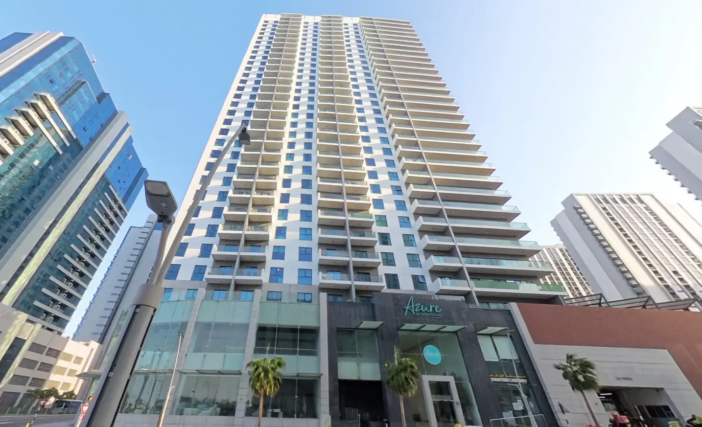 Sleek mid-rise exterior architecture of Oasis Residences in Shams Abu Dhabi on Al Reem Island with landscaped gardens