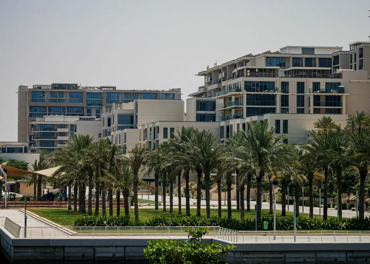 Al Faridah building entrance in Al Zeina, Al Raha Beach, Abu Dhabi, showcasing residential access and exterior surroundings.