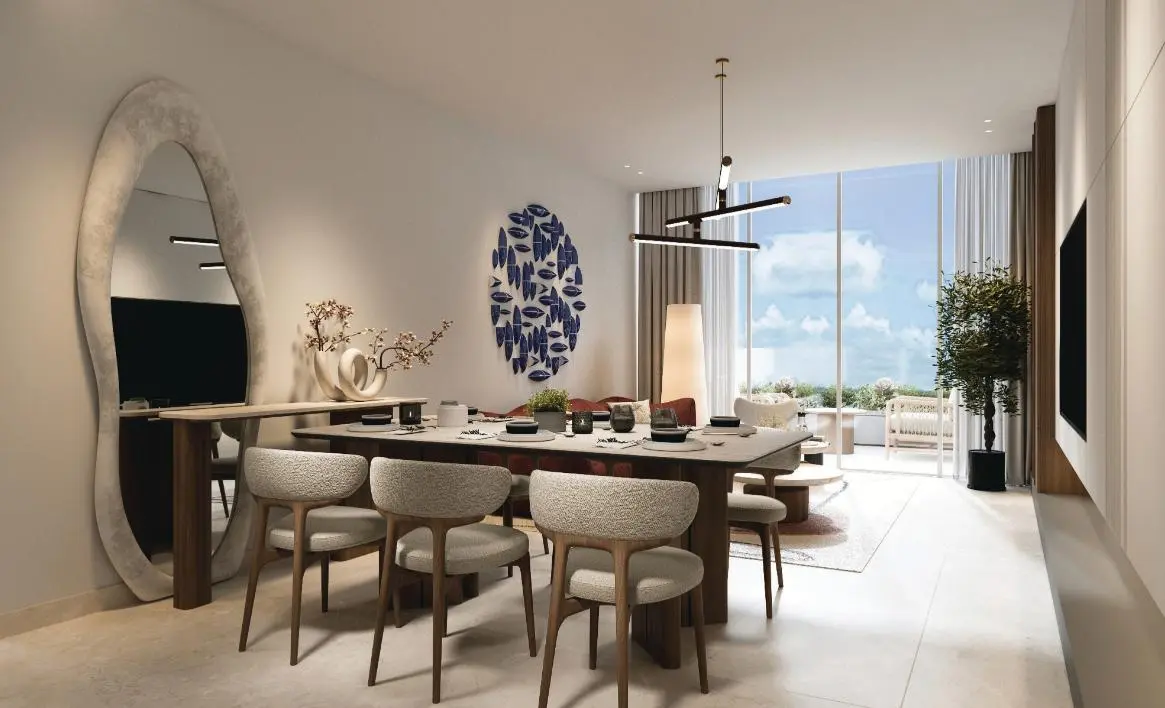 Stylish dining area in Juman 3 Luluat Al Raha offering seamless indoor-outdoor luxury living with marina views..jpg